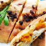 slices of sage, squash and stilton calzone